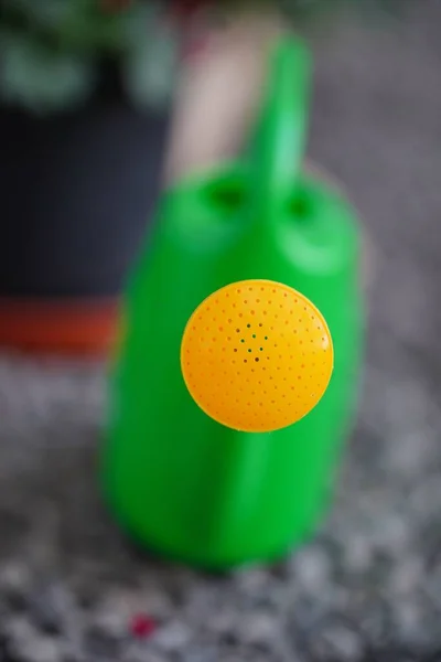 Vertical Closeup Green Watering Can Yellow Spout — Stock Photo, Image
