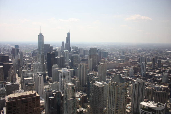 A bird's eye view of the cityscape of Chicago, the United States on a sunny day
