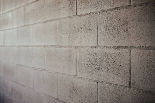 A closeup shot of a gray brick wall surface