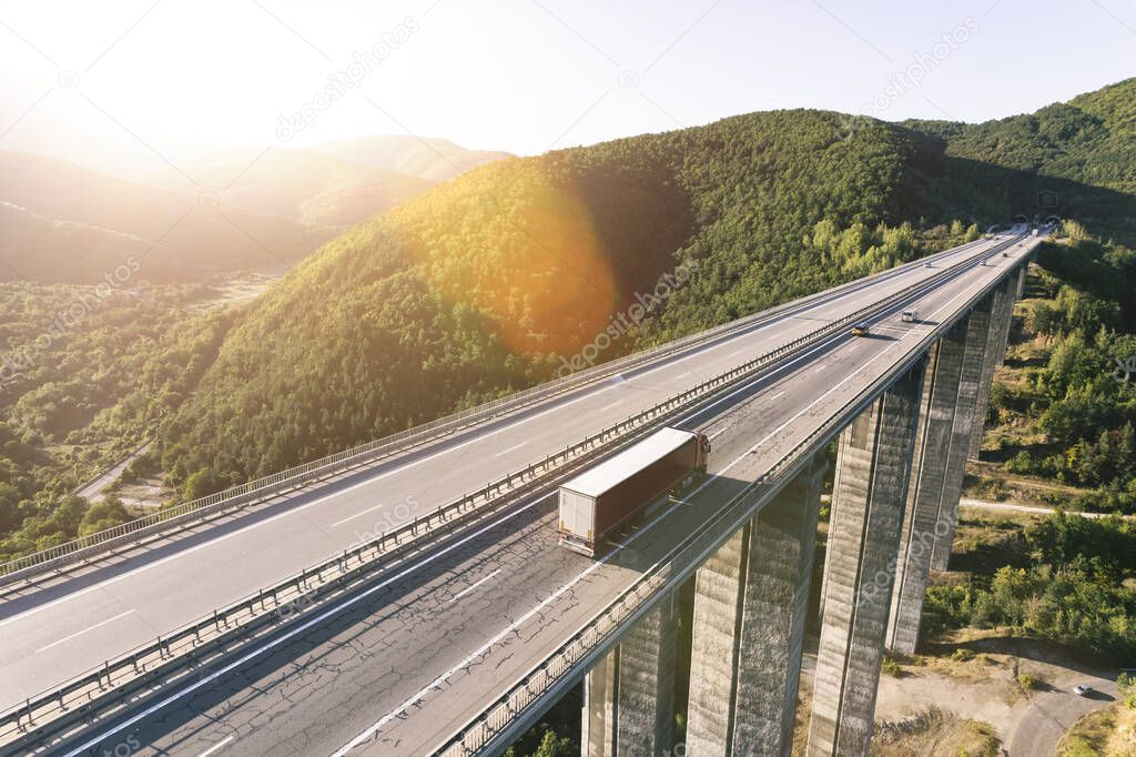 An aerial view of a cargo delivery truck on a highway