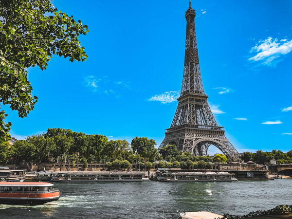 A scenic view of the Eiffel Tower on a sunny day in Paris, France