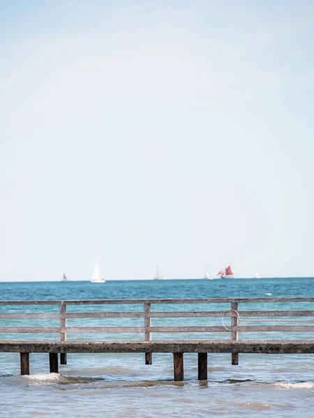 Vertical Shot Wooden Bridge Ocean Ships Sailing Background — Stock Photo, Image