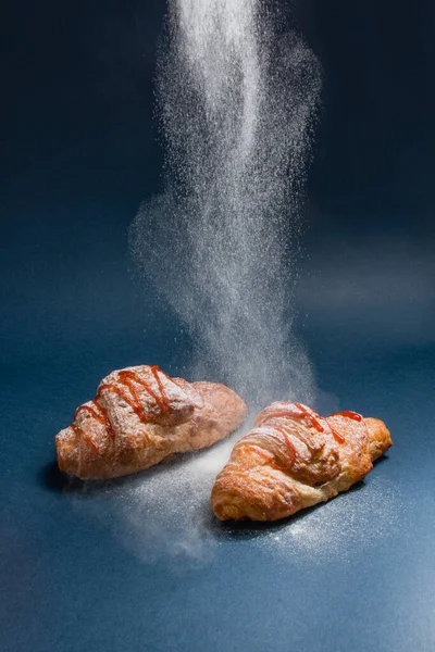Portrait Croissants Being Dusted Powdered Sugar Black Background — Stock Photo, Image