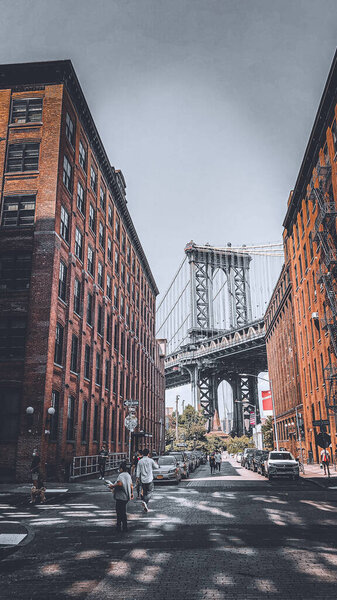 A vertical shot of Brooklyn Bridge seen from Dumbo in New York City, New York