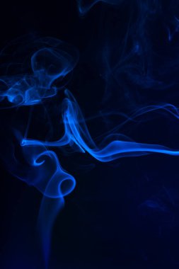 An abstract colorful smoke-like illustration isolated on a black background