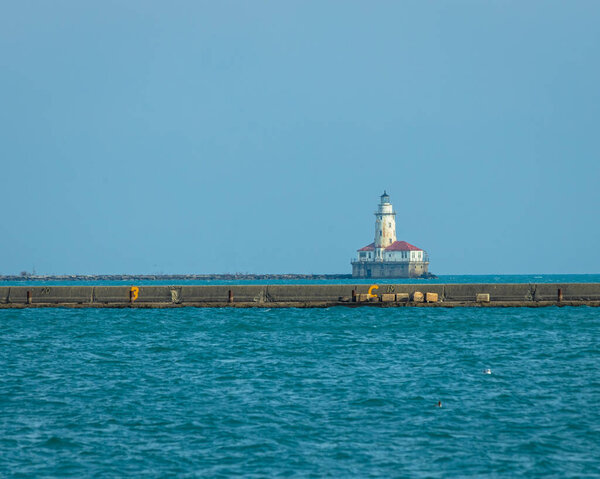 The Chicago harbor lighthouse is viewed from a distance