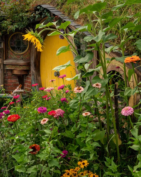 Closeup Iconic Yellow Door Surrounded Blooming Flowers Hobbiton New Zealand — Stock Photo, Image