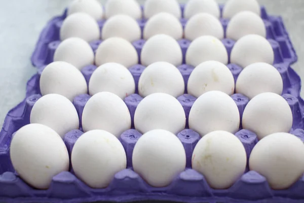 Closeup Shot Purple Tray Full White Eggs Table — Stock Photo, Image