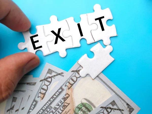 Banknotes White Puzzle Written Text Exit Blue Background Trading Concept — Stock Photo, Image