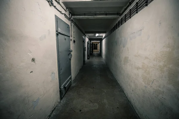 Eerie Scenery Abandoned Building Old White Walls Iron Grey Doors — Stock Photo, Image