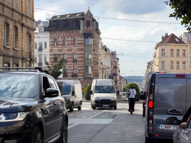 Row of cars stopped at the red traffic light in Bruxelles