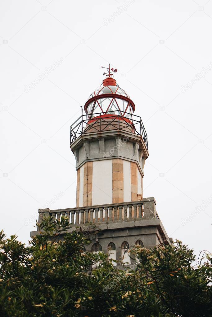 A vertical closeup shot of the Cape Higuer Lighthouse in Basque Country Region, Spain