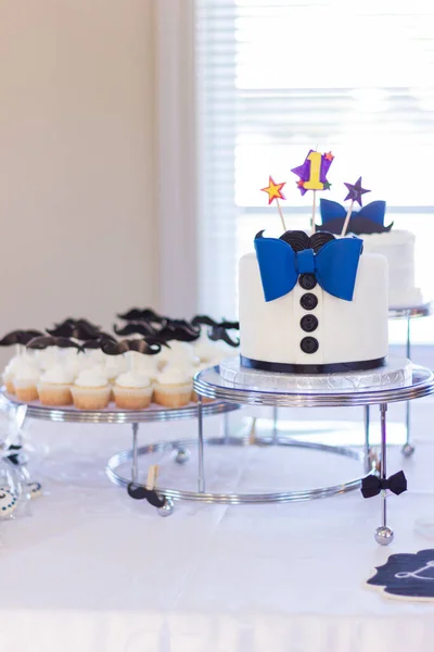 Small Birthday Cake Blue Bow Tie Tiny Cupcakes Side — Stock Photo, Image