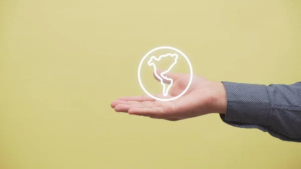 A closeup shot of a hand with the logo of the earth