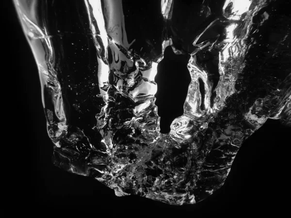 A closeup shot of a ice peace on a black isolated background