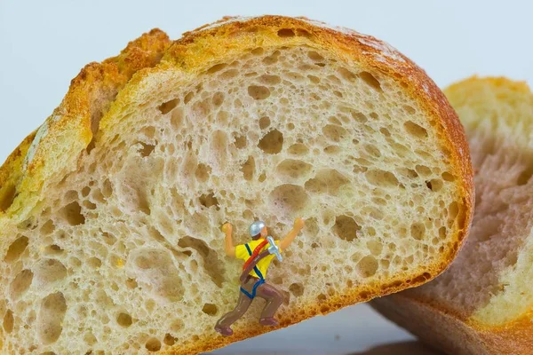 Climber Climbs Fresh Tasty Bread Macro Photo Miniature Figures Scene — Stock Photo, Image