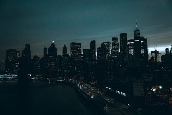 Beautiful Manhattan nightscape with illuminated skyscrapers, USA