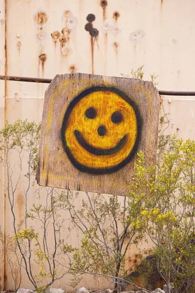 Vertical Shot Yellow Smile Emoji Drawn Wooden Surface Outdoors — Stock Photo, Image