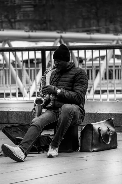Vertical African Street Artist Playing Saxophone London Grayscale — 스톡 사진