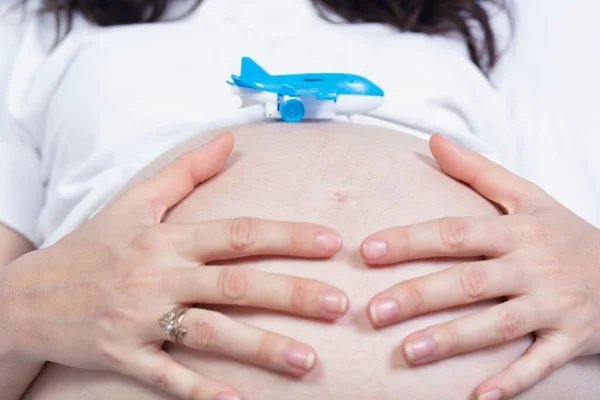 Closeup Blue Toy Plane Pregnant Belly — Stock Photo, Image