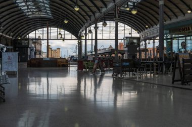 A quiet evening view of Newcastle upon Tyne Central Station, UK, as RMT and ASLEF trade unions strike over pay in July and August 2022. clipart