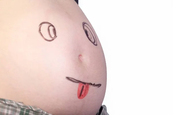Közelkép Egy Terhes Has Egy Szórakoztató Arc Rajz — Stock Fotó