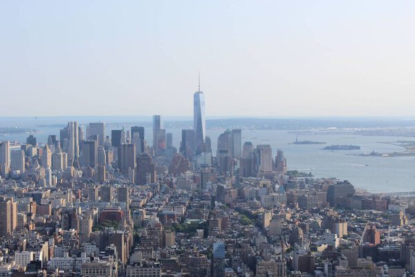 Beautiful cityscape of Lower Manhattan, New York, with skyscrapers and sea visible in the far