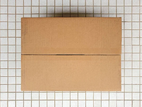 High Angle View Plain Cardboard Box White Tiled Floor Space — Stock Photo, Image