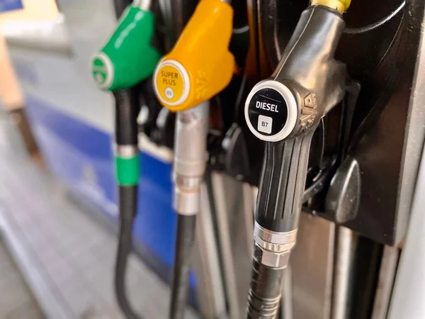 Closeup Gasoline Nozzles Fuel Types Names — Stock Photo, Image