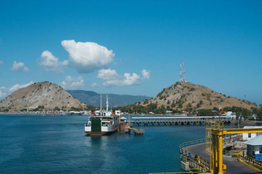 Poto Tano, West Sumbawa, Indonesia - July 9, 2022: ASDP ferry ships that are leaning on the Pototano harbor ready to depart clipart