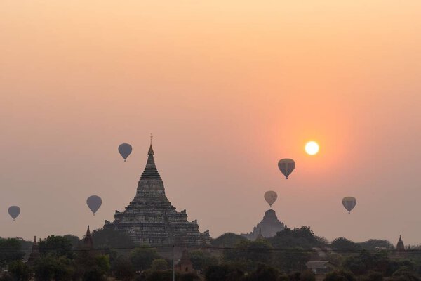 A scenic sunrise with hot air balloons in Old Bagan, Myanmar (Burma)
