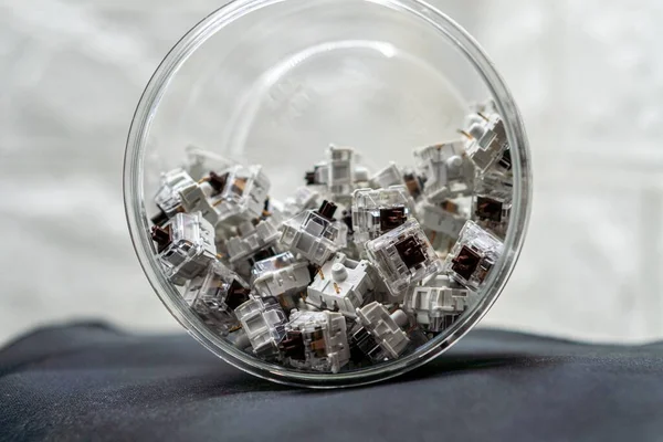 Closeup Mechanical Keyboard Switches Piled Transparent Jar — Stock Photo, Image