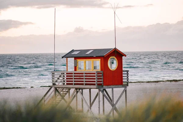 A red lifeguard hut on the Skanor beach in Falsterbo, Skane, Sweden