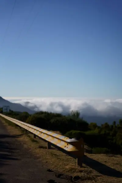 Vertical Shot Metal Crash Barrier Road Blurred Trees Clouds Background — Stock Photo, Image