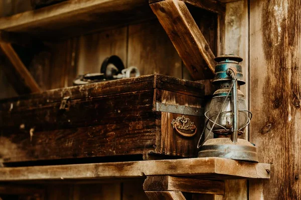 Old Dusty Kerosene Lamp Next Wooden Box Shelf Barn — Stock Photo, Image