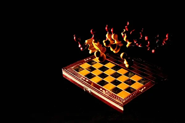 Game Vintage Traveling Chess Set Figurines Flying Isolated Black Background — Stock Photo, Image