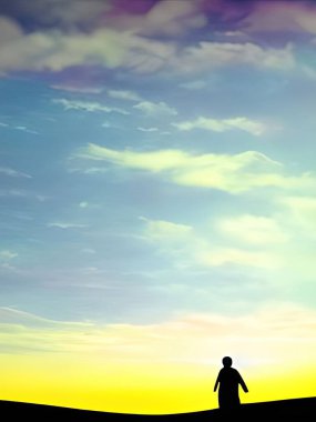 Tepede koyu renk arka planlı siyah bir adam silueti