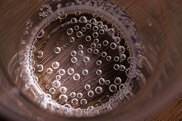 Bubbles Sparkling Water Bottom See Thru Plastic Glass — Stock Photo, Image