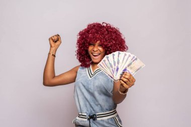 excited and happy african lady flaunting some cash clipart
