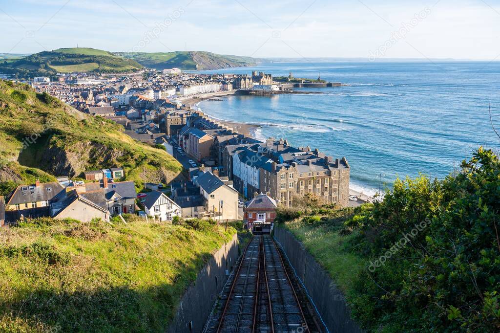 A railroad taking to Aberystwyth town of Wales with a view of the sea
