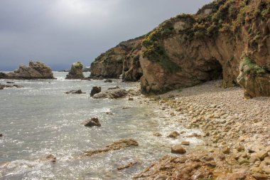 rocks and caves in a sunrise in the Cantabrian sea