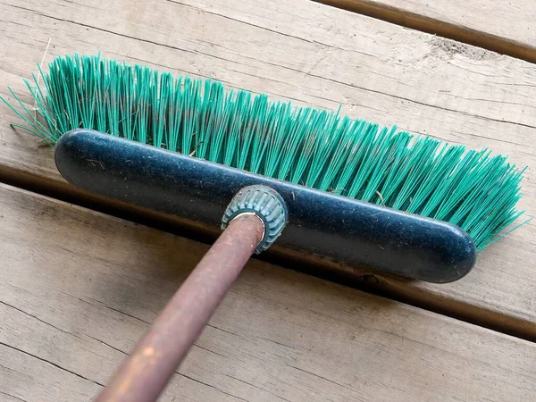 View Outdoor Broom Stiff Green Plastic Bristles Backyard Brick Paving — Stock Photo, Image