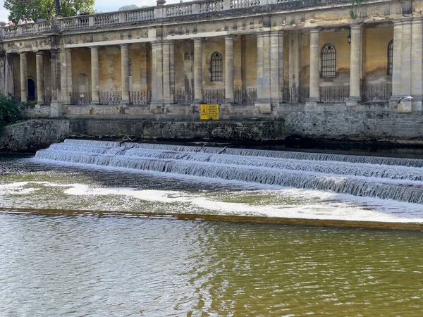 A picturesque three-stage dam on the river Avon in Bath City