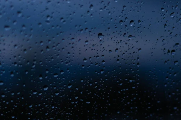 Closeup Water Drops Glass Dark Blurred Background — Stock Photo, Image