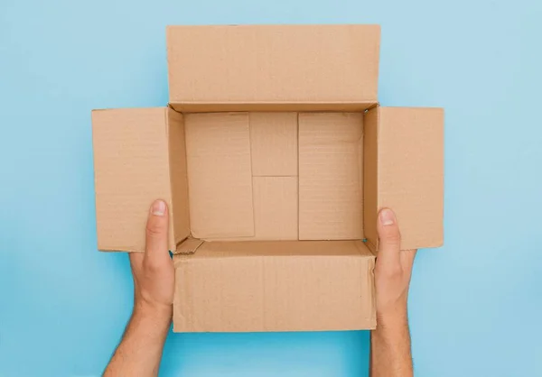 Top View Male Hands Presenting Opened Carton Package Content Touching — Stock Photo, Image