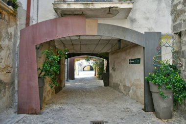 A narrow street in Castelvenere, a medieval village in the province of Avellino in Campania, Italy.