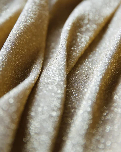 Vertical Closeup Golden Textile Flowing Material Lots Glowing Particles Shimmering — Stock Photo, Image