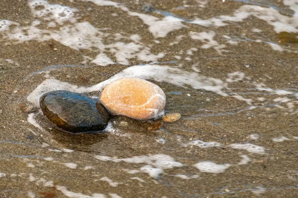 Achtergrond Van Een Heleboel Kleine Steentjes Aan Het Strand Met — Stockfoto