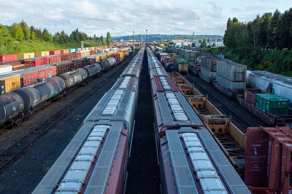 An aerial view of a cargo train yard in Magnolia, Seattle