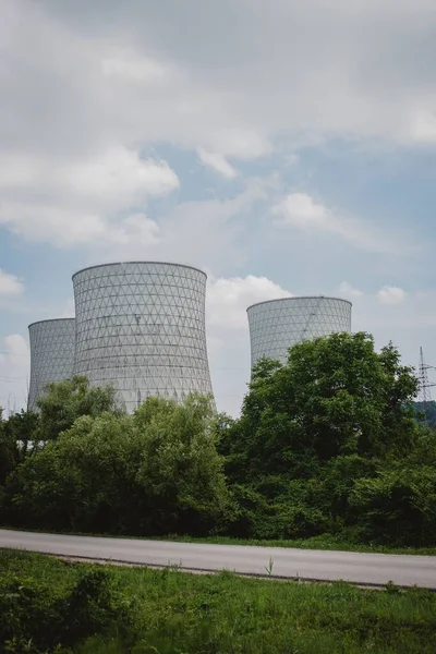 The Nuclear reactor behind the road with trees